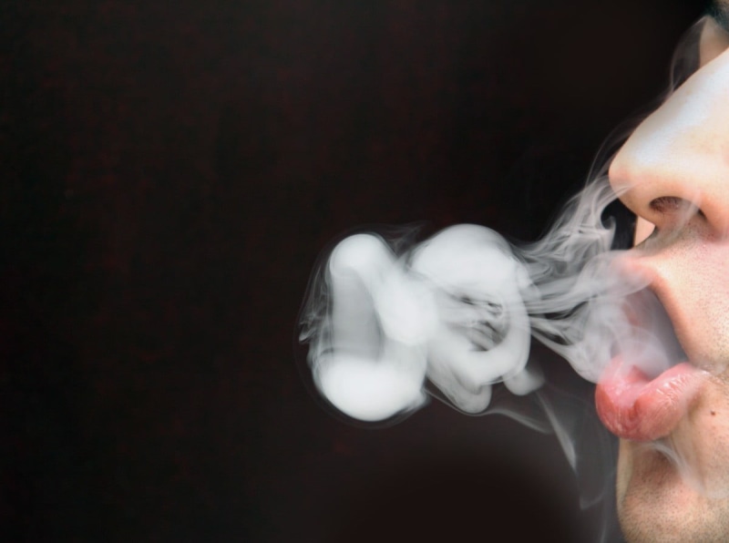 activity, lips, headshot, profile view, adult, copy space, bad habit, smoking, black background, smoking - activity, human body part, one person, smoke - physical structure
