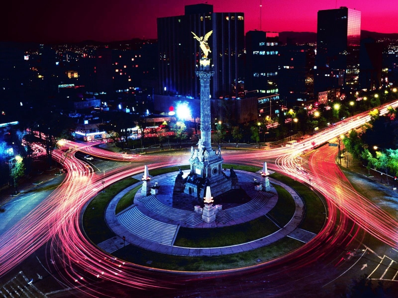 Mexico, multiple lane highway, motion, night, road, building exterior, city life, office building exterior, sky, transportation, traffic, illuminated, train