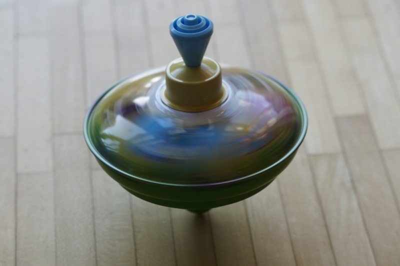 turn, play, rotate, glass, dance gyro, dance, food and drink, top, bottle, surface, brown, water, no people, top spinning, green, blue, spin, container