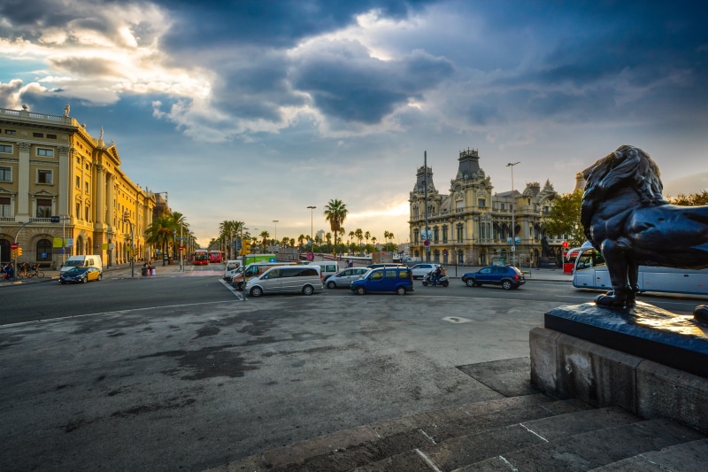 cloud - sky, incidental people, city, lion, european, place of worship, land vehicle, statue, roundabout, travel, religion, catalonia, buildings, landmark