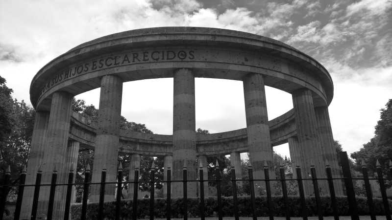 cloud - sky, western script, nature, text, building exterior, low angle view, sky, the past, architecture, guadalajara, travel destinations, history, outdoors