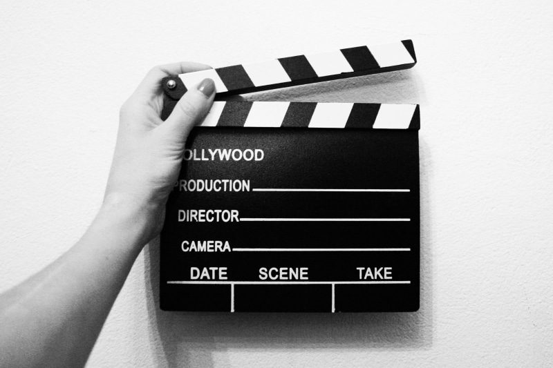 human hand, human body part, direction, finger, writing Slate, body part, wall - building feature, producer, gray, western script, indoors, industry, one person