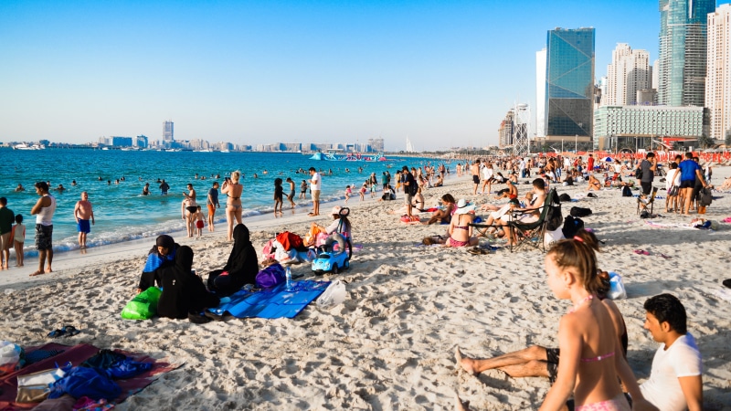 dubai, enjoyment, lifestyles, blue sky, marina, children, 5K, trip, ocean, sand, buildings, swimming, crowd, land, leisure, near, real people, water, resort