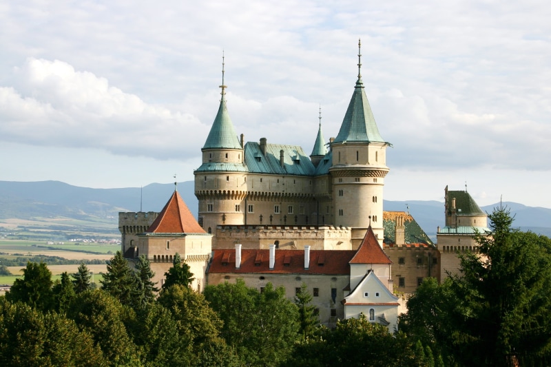 tree, city, sky, tower, built structure, belief, no people, photography, view, summer, spire, castle, building, 2K, slovakia, place of worship, day, outdoors