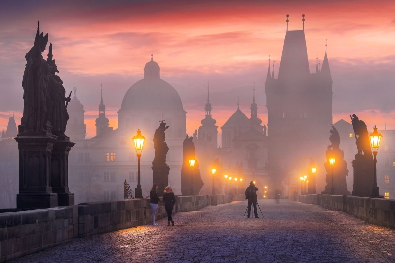 real people, street, women, long exposure, sky, built structure, old building, Czech Republic, religion, orange color, illuminated, street light, lifestyles
