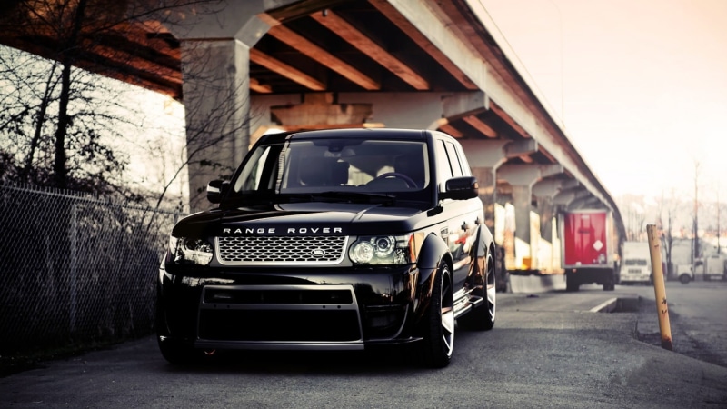 mode of transportation, daytime, outdoors, concrete, black cars, street, day, headlight, built structure, bridge, Range Rover, transportation, land, architecture