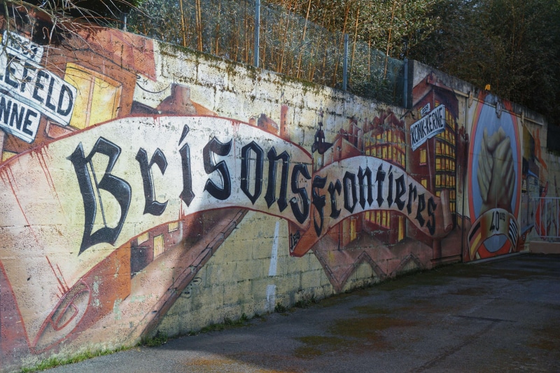 day, art and craft, brick wall, communication, city, built structure, graffiti, mural, building exterior, no people, rudeness, architecture, brick, mur peint