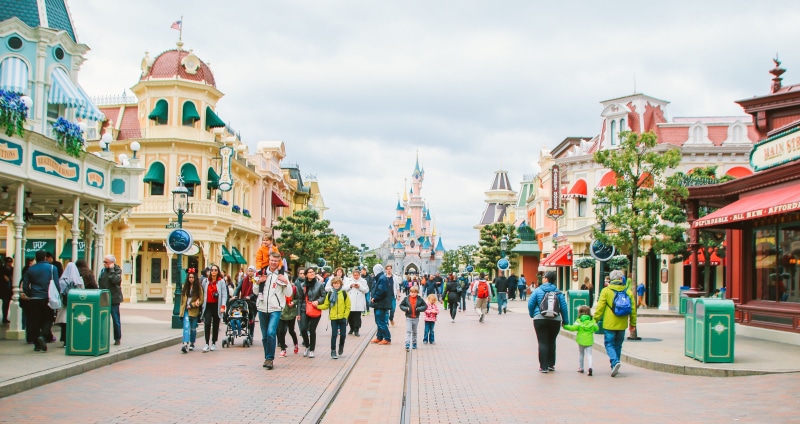main street, universe, day, color, adult, sky, built structure, outdoors, city street, walking, paris, architecture, men, disney, sleeping beauty, building exterior