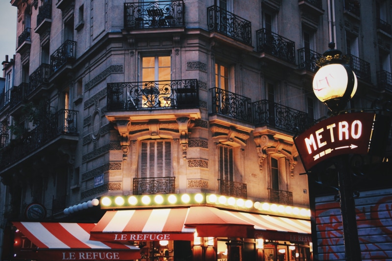 lamarck - caulaincourt, montmartre, low angle view, text, city, france, script, non-western script, dusk, built structure, illuminated, building, no people