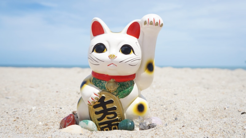 oriental, holiday, asia, art and craft, waving, human representation, sand, outdoors, sky, cat, symbol, fortune, feng shui, no people, chinese, horizon over water