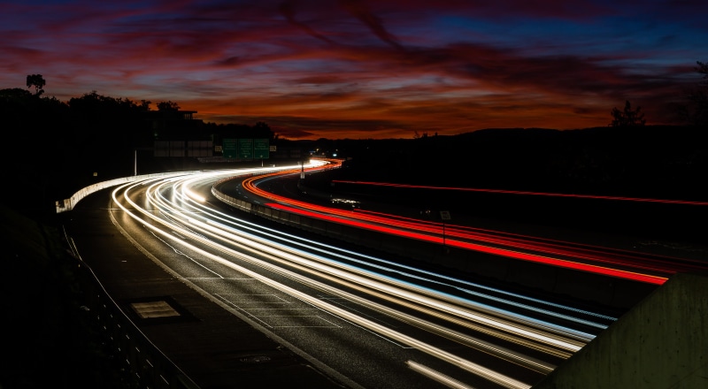road, asphalt, dark, multiple lane highway, transportation, mode of transportation, straße, illuminated, dusk, cloud - sky, light trail, speed, sky, city
