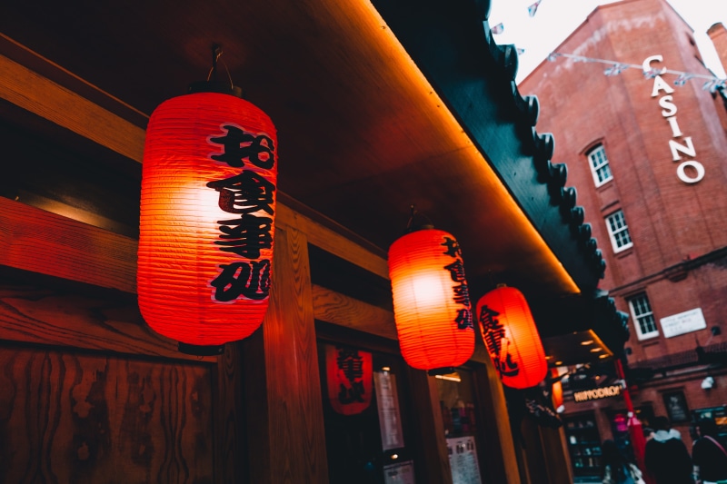 night life, hanging, text, lantern, casino, illuminated, orange color, lighting, chinese lantern, building exterior, communication, city, asian, beside