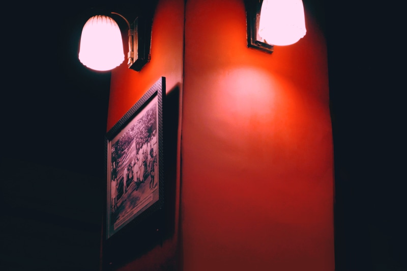 lighting equipment, close-up, spoke, light fixture, light, electric lamp, 5K, headlight, western script, architecture, red, dark, lantern, flashlight