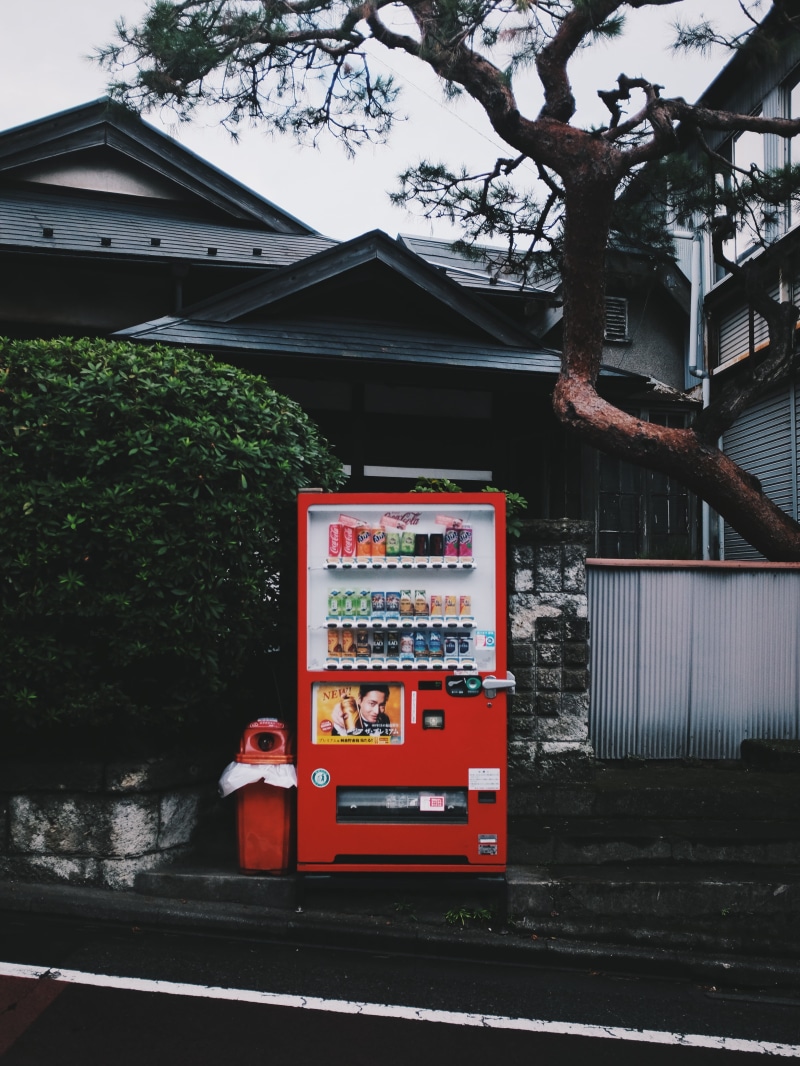 transportation, communication, building exterior, built structure, trashcan, house, plant, road, nature, red, street, outdoors, vending machine, building