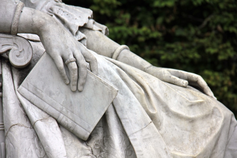close-up, woman, white, history, stone material, human representation, outdoors, stone, no people, memorial, book, representation, the past, hand, craft