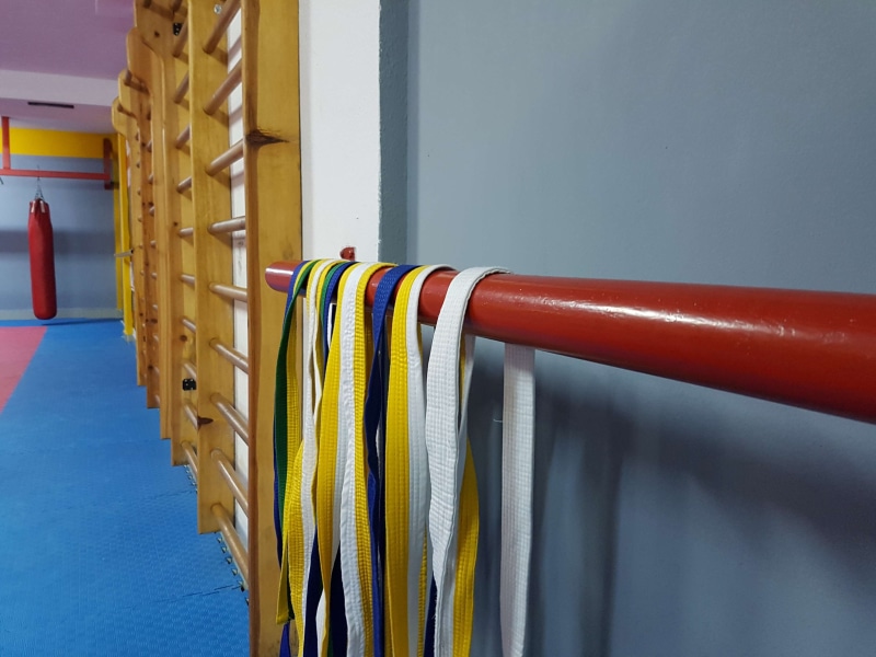 blue, focus on foreground, connection, wall - building feature, safety, order, multi colored, no people, day, close-up, built structure, graduation day taekwondo dojo gym