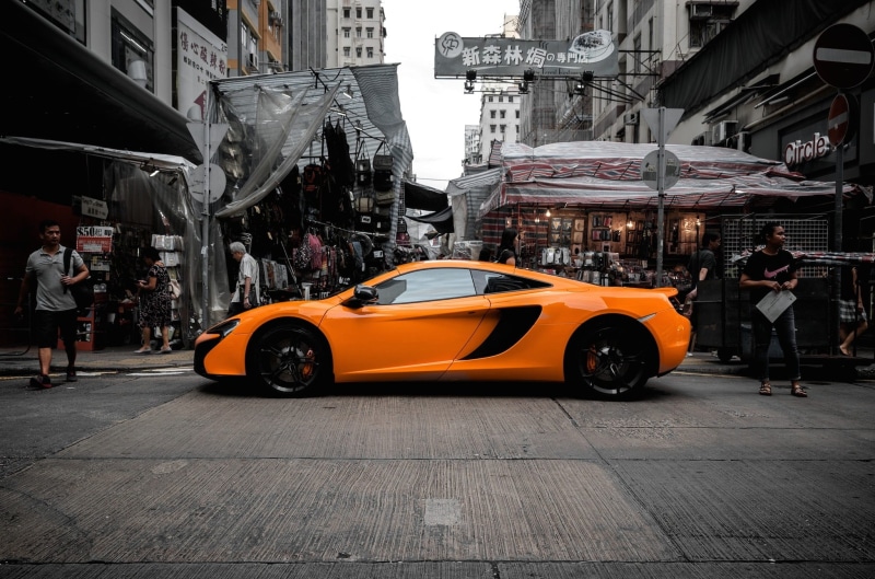 motor vehicle, along, transportation, supercar, outdoors, architecture, taxi, yellow taxi, road, speed, urban, kong, hong, maclaren, car, built structure