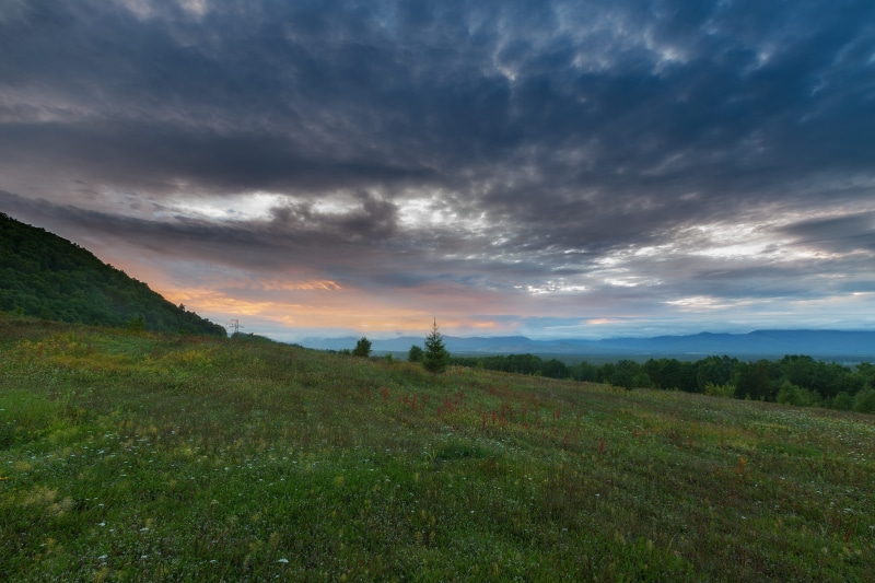 sky, rural scene, tranquility, beauty, impression, beauty in nature, grass, colors, plant, height, outdoors, far, landscape, mountains, scenics - nature