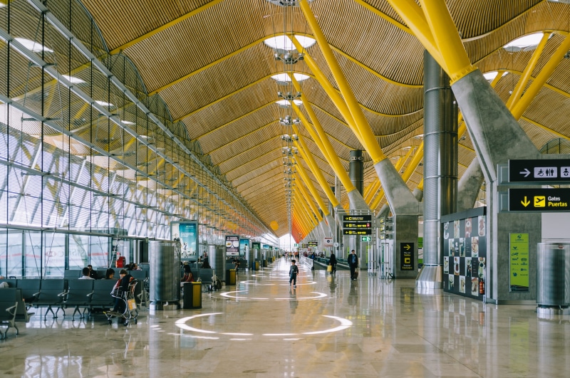 indoors, illuminated, people, waiting, incidental people, station, flooring, sign, transportation, airport, built structure, layover, airport terminal