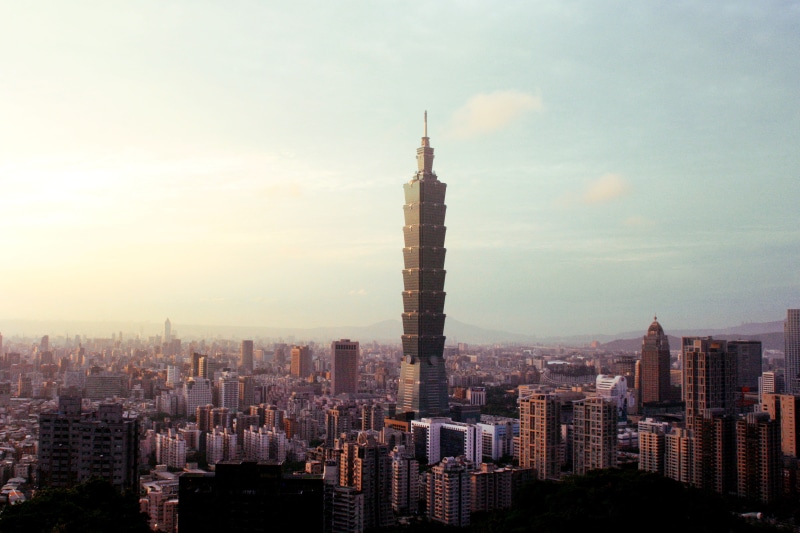 spire, skyscraper, taiwan, no people, tall - high, rise, angle, travel, taipei world financial center, high, outdoors, blue, sky, skyline, sunset, nature