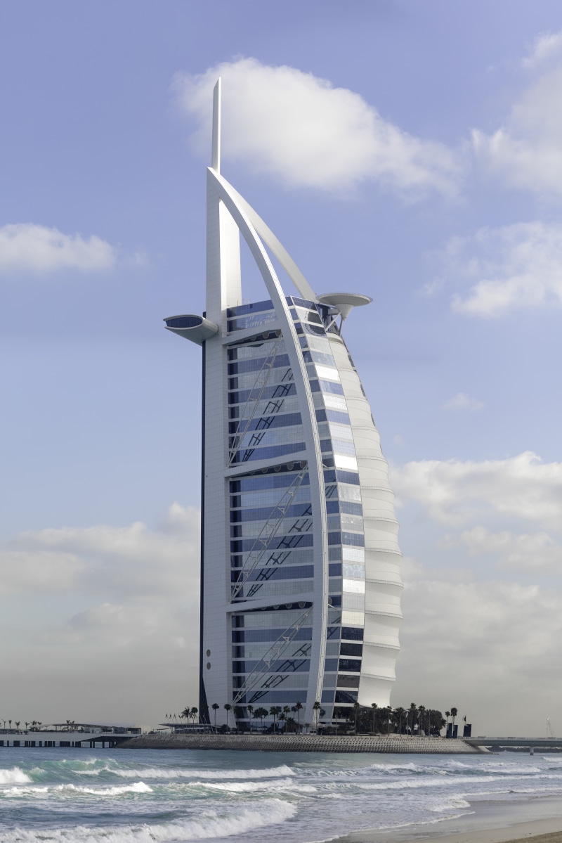 8K, office building exterior, building, tower, travel destinations, tall, no people, middle, beach, photo, clouds, sea, skyscraper, water, architecture