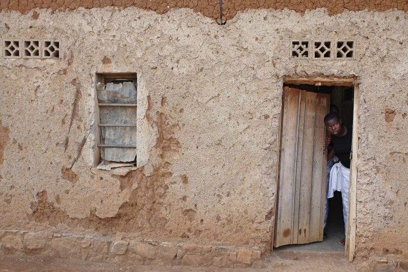 poor, door, building exterior, poverty, africa, one person, outdoors, architecture, shack, kigali, entrance, weathered, stucco, girl, window, african, hut