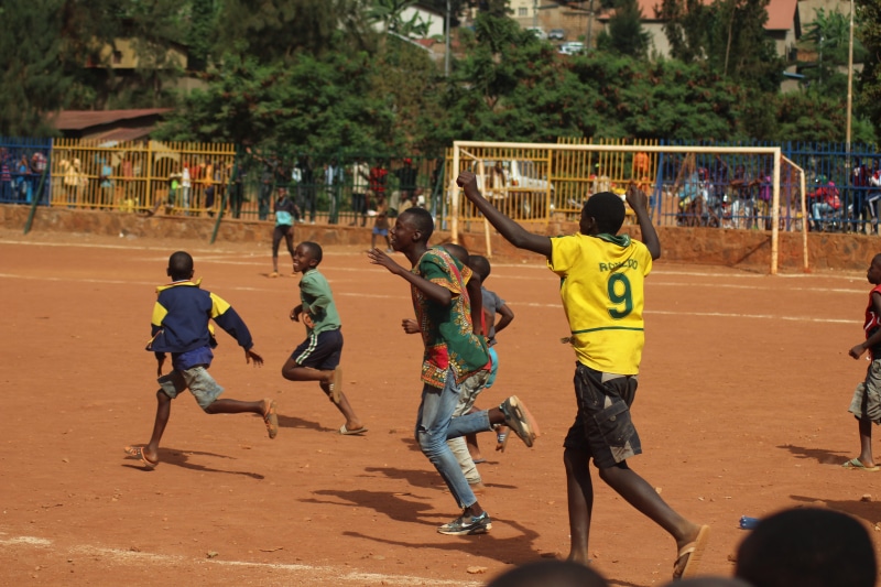 real people, football field, football, kigali, brown, full length, field, africa, soccer, lifestyles, child, men, win, males, deporte, group of people