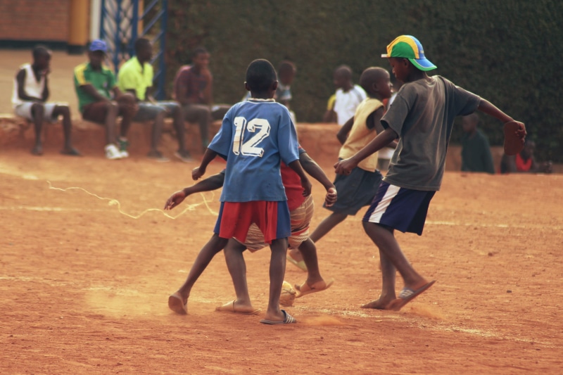real people, rwanda, standing, sport, competition, casual clothing, leisure activity, football, 2K, uniform, group, clothing, spectator, men, focus on foreground