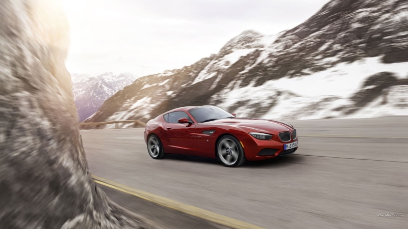 model, on the move, red, snow, travel, motor vehicle, BMW Z4, cast, outdoors, road trip, mode of transportation, beetle, nature, road, mountain, transportation