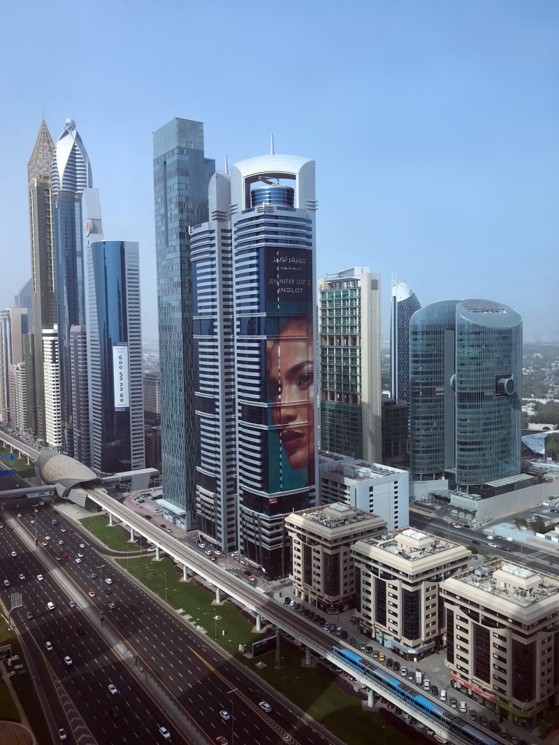 road, skyscraper, holiday, travel, young men, buildings, built structure, tower, young adult, landscape, sky, city life, united arab emirates, cityscape