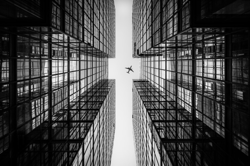 reflection, building exterior, low angle view, no people, built structure, modern, glass - material, bw, airplane, tall - high, bottom view, nature, skyscraper