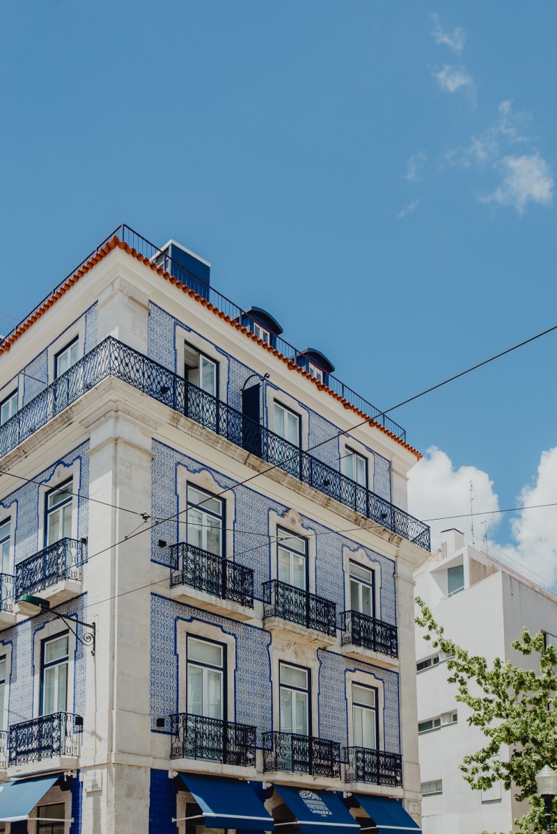 no people, building, residential district, tree, blue, city, cloud - sky, portugal, low angle view, nature, lisbon, lisboa, railing, sunlight, cityscape