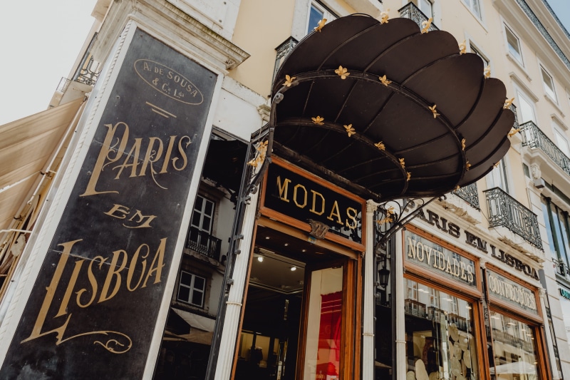 day, portugal, text, Europe, low angle view, food and drink, city, communication, travel destinations, illuminated, street, lisboa, sign, non-western script