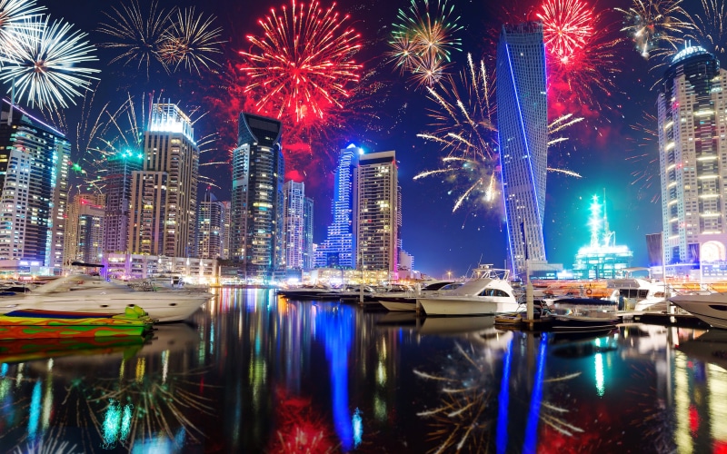 no people, waterfront, night, skyscraper, holidays, united, building, reflection, modern, built structure, arab, city life, motion, architecture
