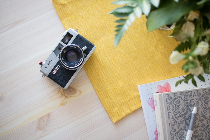white, surface, camera, indoors, no people, yellow, table, photography themes, camera - Photographic Equipment, wood - Material, high angle view, digital camera