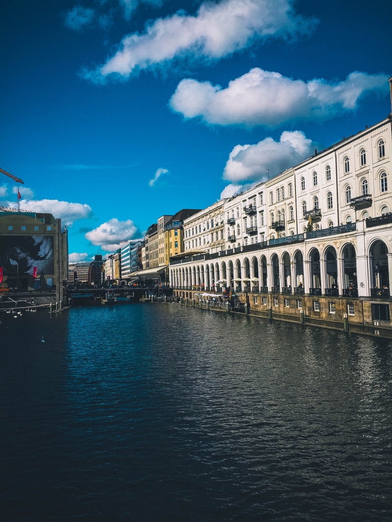 city, reflection, buildings, building exterior, water, travel, architecture, outdoors, waterfront, white, channel, transportation, no people, urban, 2K