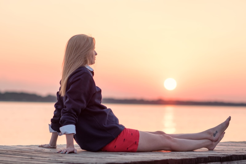 orange color, hairstyle, dusk, sitting, tranquility, girl, 4K, beauty in nature, jackson, lake, outdoors, one person, shorts, adult, sky, sun, tranquil scene