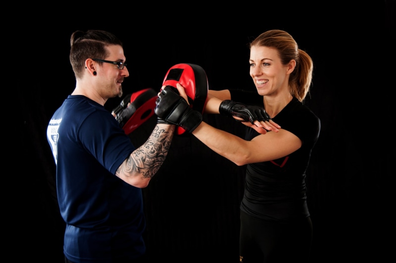 security, young men, martial arts, training, muay thai, woman, black background, mid adult men, lat sao, wing tzun, adult, weapon, kung fu, protection