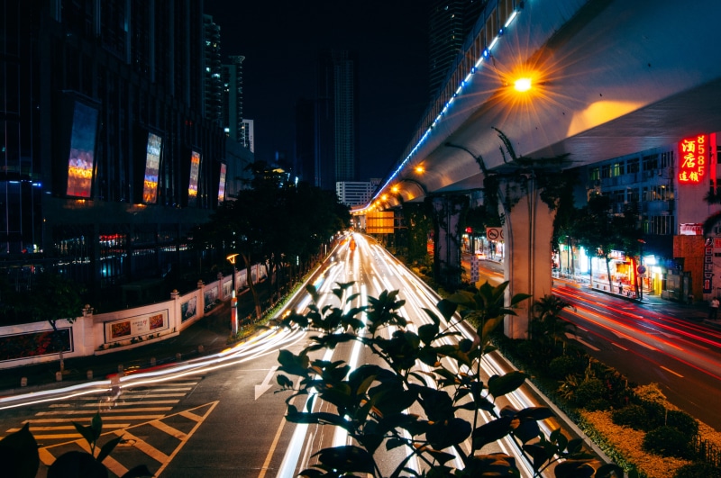 motor vehicle, sign, road, road marking, architecture, symbol, motion, illuminated, transportation, street, mode of transportation, built structure, outdoors