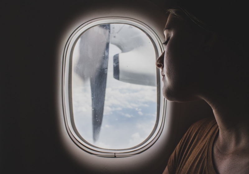 cloud, leisure activity, glass - material, journey, engine, air vehicle, fly, sky, looking, adult, one person, transportation, plane, scoop, story, headshot