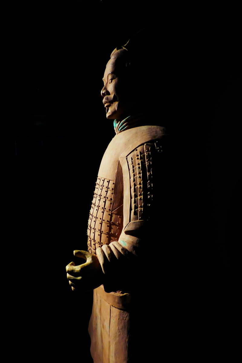 lifestyles, leisure activity, china, copy space, dark, young adult, young men, clay figure, profile view, real people, contemplation, one person, three quarter length