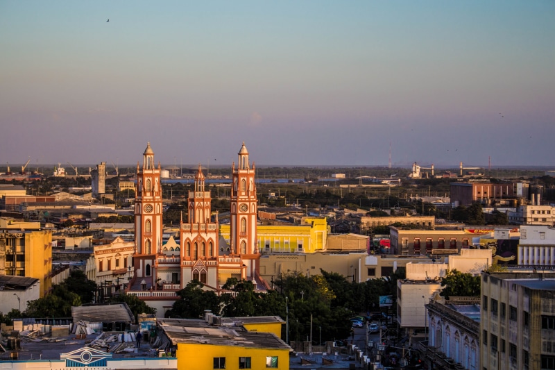 high angle view, sky, barranquilla, car, land vehicle, religion, built structure, heritage, residential district, outdoors, history, mode of transportation
