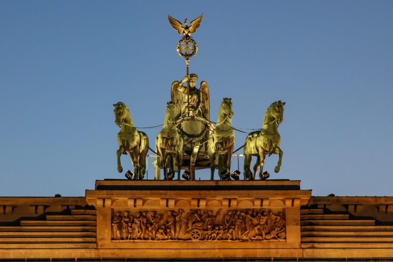 germany, outdoors, built structure, creativity, city gate, angel, travel destinations, building, clear sky, national socialism, quadriga, landmark, the past