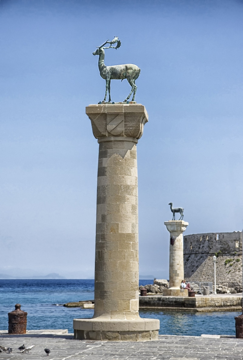 monuments, day, built structure, blue, representation, statue, human representation, creativity, clouds, atop, rhodes, architecture, deer, harbor, water