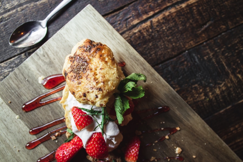 atop, sweet food, wood - material, garnish, dessert, 4K, still life, indoors, drizzled, sauce, buns, freshness, eating utensil, grilled, red, fruit, leaf