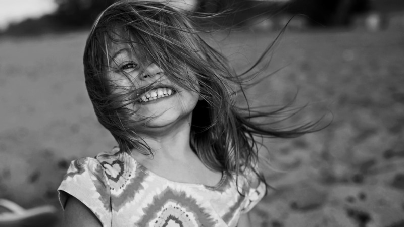 hair in face, headshot, girls, land, children, females, childhood, outdoors, long hair, human hair, happiness, positive emotion, portrait, emotion, child