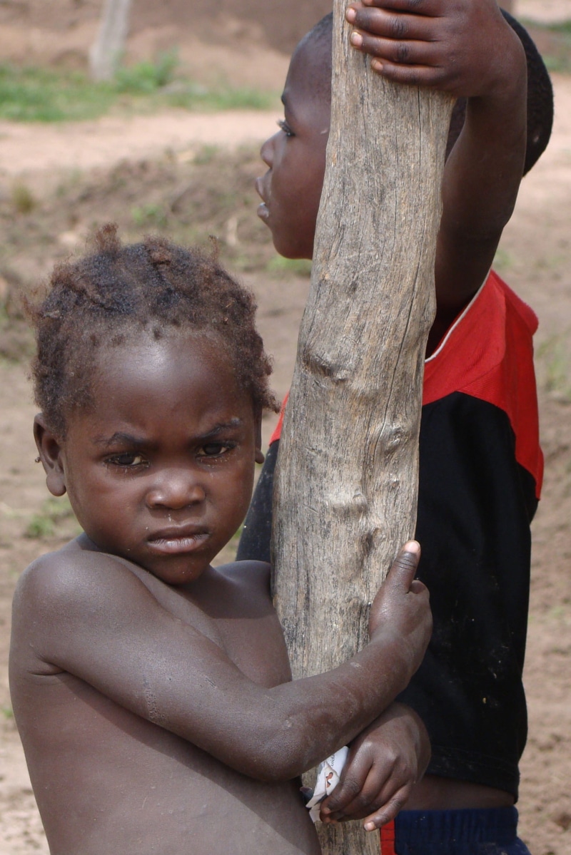 african, daytime, human body part, men, real people, females, Black, focus on foreground, portrait, African, lifestyles, Tribe, poor, childhood, misery