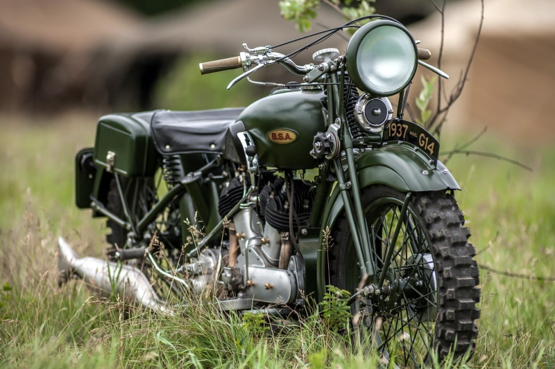 focus on foreground, green color, WWII, close-up, technology, field, selective focus, nature, stationary, riding, day, Birmingham Small Arms Company, grass
