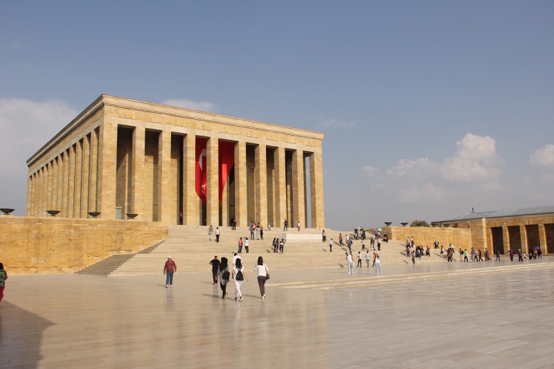 women, the past, travel, outdoors, building exterior, men, atatürk, wall relief, history, architectural column, leisure activity, group of people, built structure