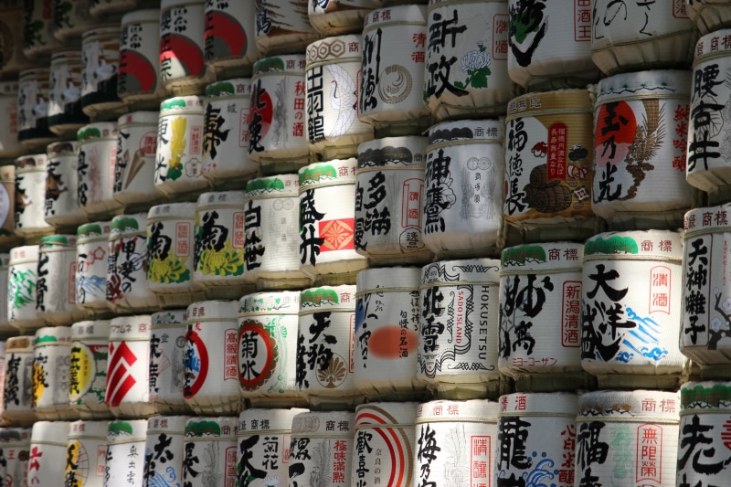 text, still life, drink, non-western script, food and drink, written, japanese characters, indoors, drums, arrangement, japan, temple, communication, abundance